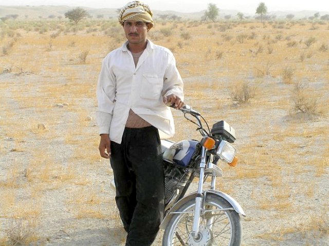 Abraham and his motor bike who helped us to reach the point. Thanks to him!