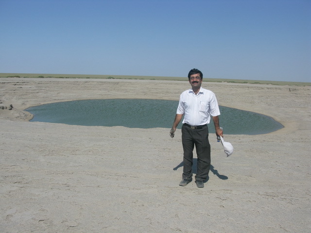 Saeed Taghinejad beside Naftijeh mud volcano