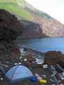 #7: A rough camp on the uninhabited Yokoate-jima on the morning of the confluence visit.  In East Asia, where environmental thinking is still in its infancy, this amount of flotsam is normal even on the remotest coasts.