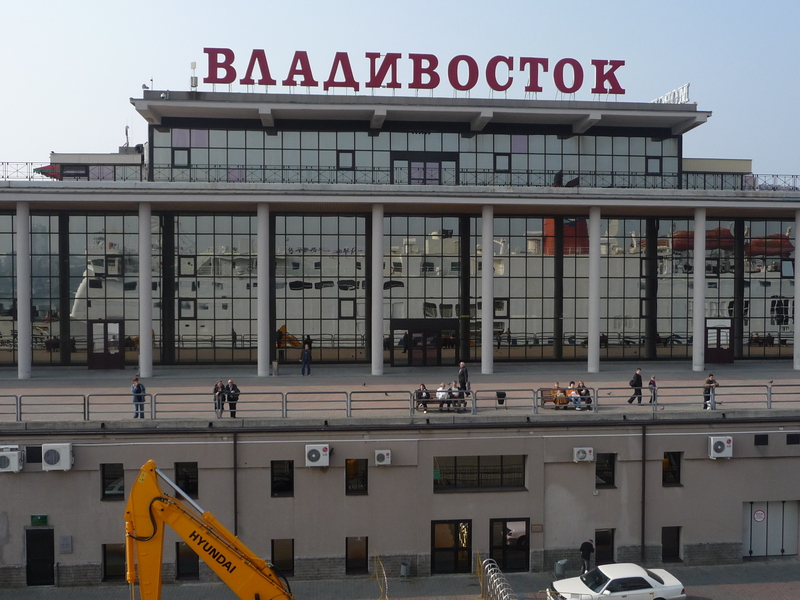 The Vladivostok marine terminal shows the reflection of the Dong Chun boat as it leaves.
