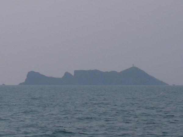 Closeup of Namuseom: a lighthouse is faintly visible on top of the isle