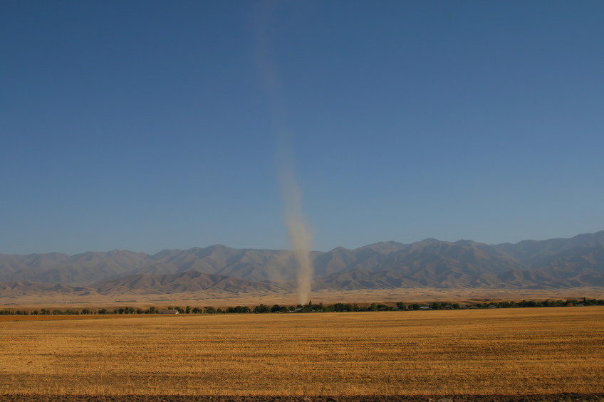 Dust devil in front of Kyrgyz Ala Too parallel to main road Tashkent - Almaty