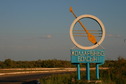 #7: Reaching tarmac at Zhambyl - sign at the end of the village
