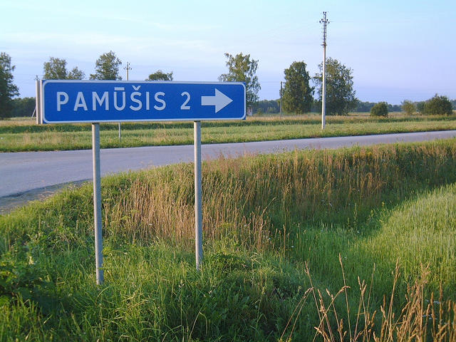 Road sign at Pamûðis, Lithuania, about three kilometres from the confluence.