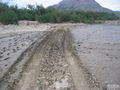#9: Muddy road that suggests an approach by 4WD