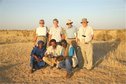 #6: Group photo (Howe-Kelley-Lees) on site, with Tuareg guide and drivers