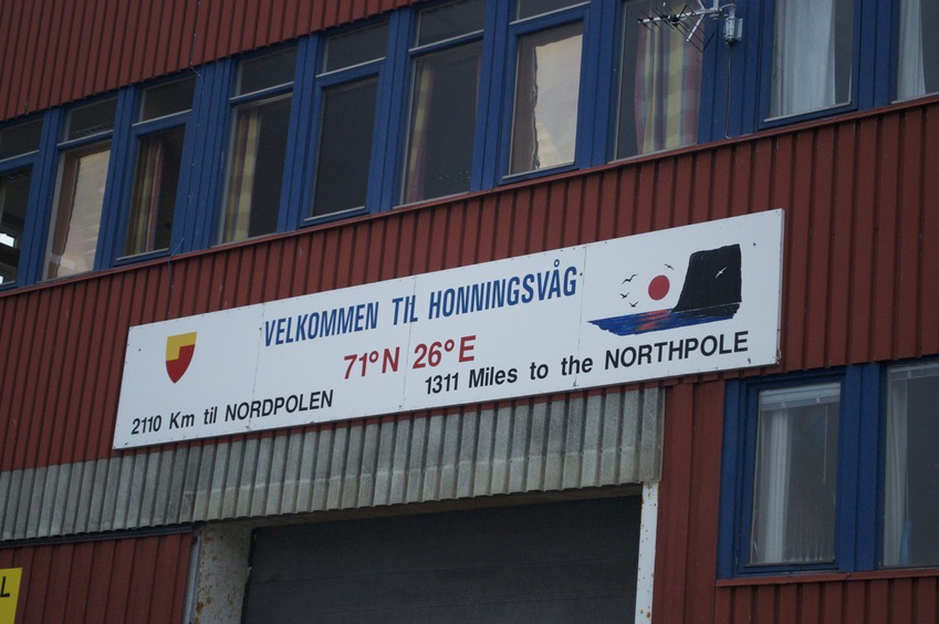 A sign in nearby Honningsvåg that notes the confluence (sort of).  (This photo was taken at midnight the previous day!)