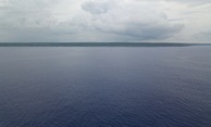 #6: A drone’s eye view of Niue from 18.9839°S 169.9375°W, at ~50 m above the ocean. The confluence point is about 7 km farther away than this, but a shipboard view from the point might be similar.