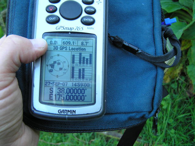 Victory!  GPS reading at the confluence site.