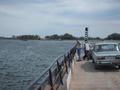 #7: On board ferry, "terminal" visible on opposite bank...