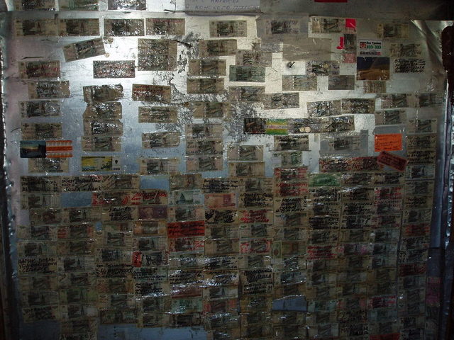 Wall with money from travelers