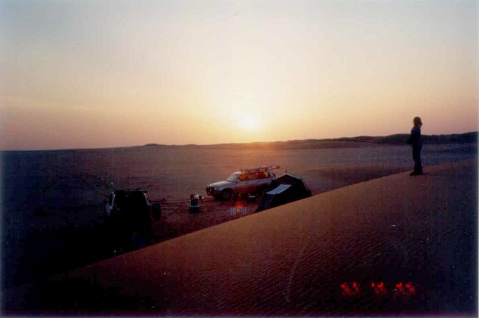 Camp at sunset time in the Dahnā' dunes