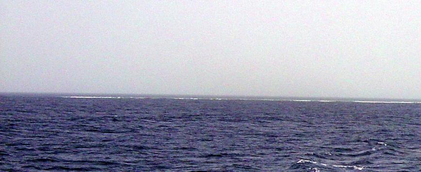 View of waves breaking over the shallow reef 800 m to the south of 25N 37E