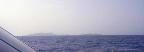 #1: View looking SE at 25N 37E with Libāna Island (foreground right) and al-Hasāniyy Island in the distance.  Photo take from the bow of Dream Voyager.