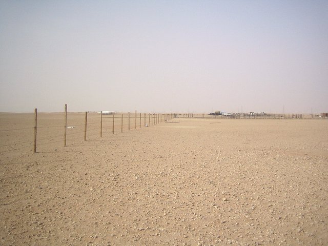 North - Fenced in with settlements in the distance