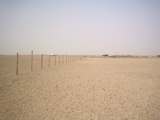 #1: North - Fenced in with settlements in the distance