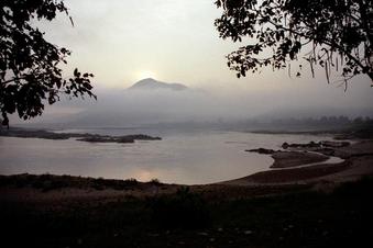 #1: Sun rising over moutain; Mekong rapids in foreground