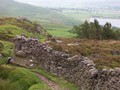 #5: rock fence on moor, with reservoir in background