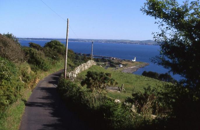 Small road leading uphill, 2.7 km west of the CP. Stranraer in the background.