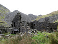 #7: Quarrymen's row house ruins with some of the many slate waste heaps in the background.