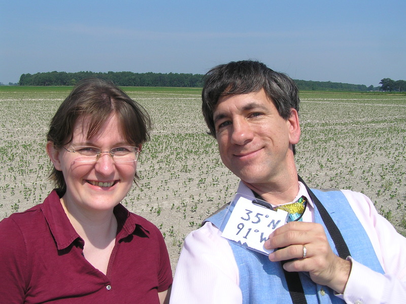 Kathrin Viehrig and Joseph Kerski standing in a field in Arkansas.