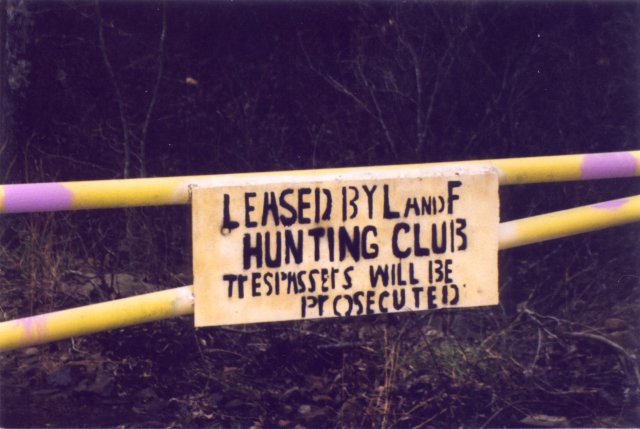 Warning sign posted by hunting club