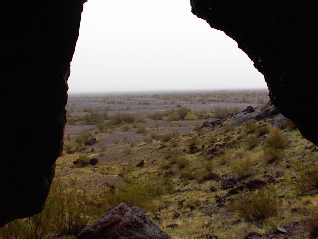 Hiking in.  Watching the rain from inside a small lava cave