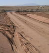 #8: The turn-off onto a freshly bladed dirt road from Highway 264, with San Francisco Peaks visible to the southwest
