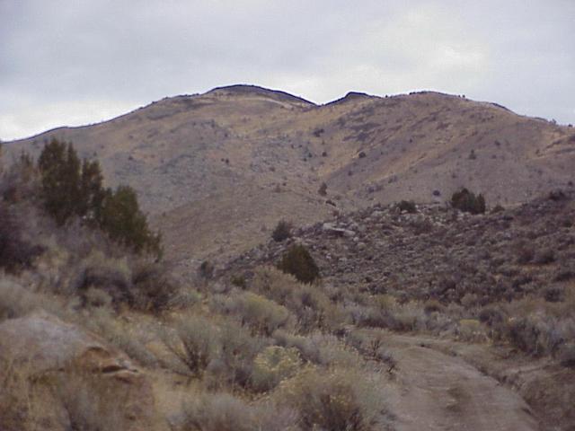 Route to the confluence site, looking northeast, confluence is to the right of the highest peak in the distance.