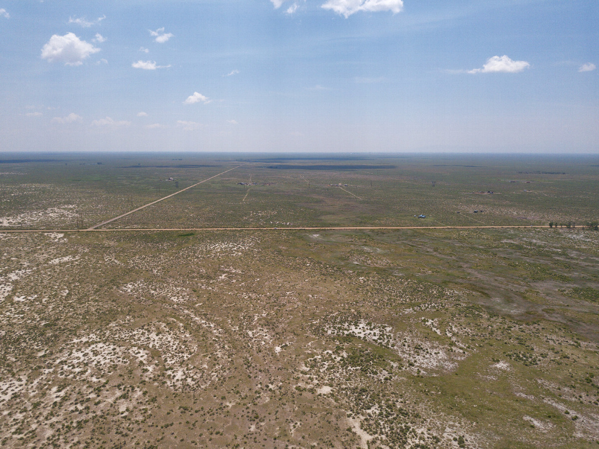 View South (down the San Luis Valley, towards County Road T, less than 1/2 mile away), from 120m above the point