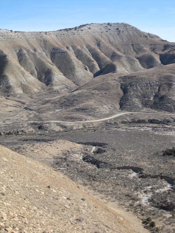 View back down the mini canyon and dry creek bed toward the car, barely visible on the far left