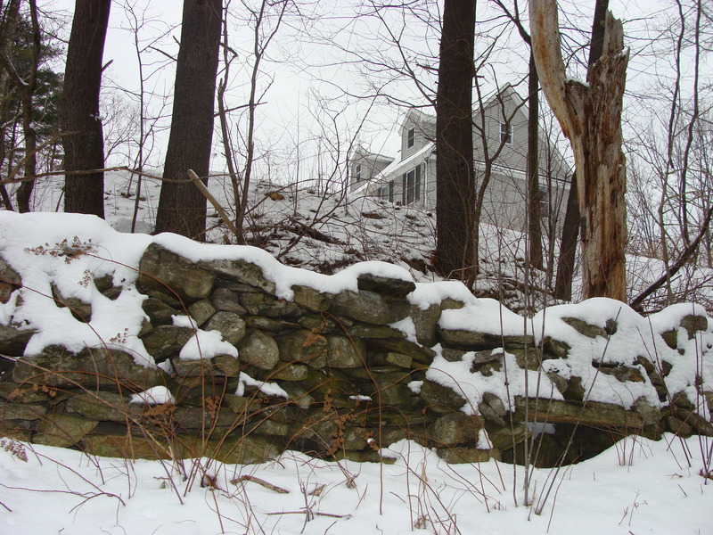 An old stone wall below the hill east of 42N 72W