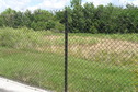 #8: View of the fence and the confluence beyond, looking northwest.