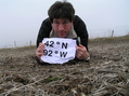 #2: Getting Grounded:  Joseph Kerski at the confluence of 42 North 92 West.
