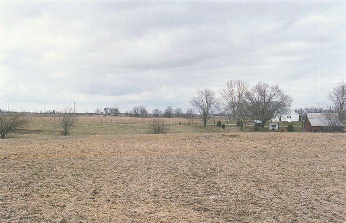 The near house is in the right of the frame when looking north from the confluence.