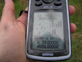 #3: Success despite the rain:  The GPS receiver at the confluence point.