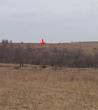 #5: Looking back at the spot about ¾ of a mile from the truck. Red Arrow marks the spot.