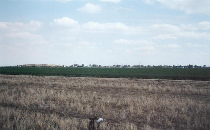 Looking southeast toward Holcomb, KS, with Holcomb High School on the left.
