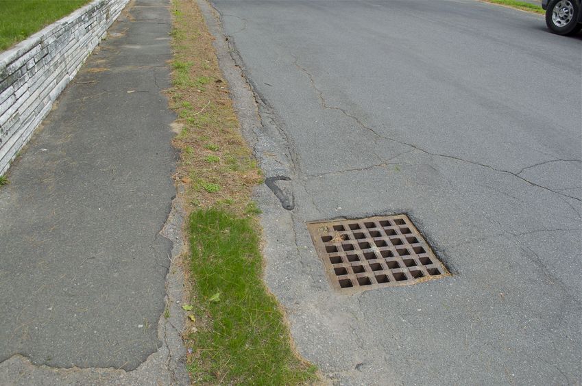 The confluence point lies on this suburban road, close to this storm drain