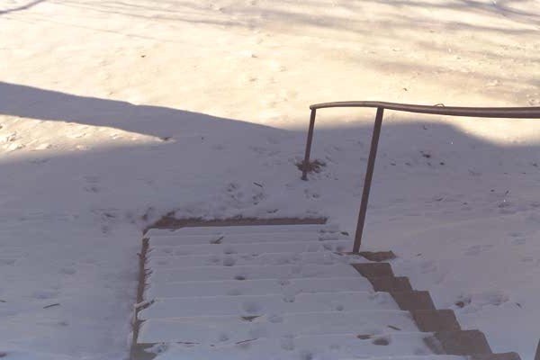 Looking down snow-covered stairs