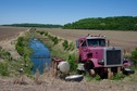 #7: The engine of this truck is apparently being used to run a pump for this irrigation canal