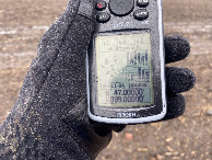 #6: GPS unit with my frozen hand at the confluence point. 