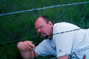 #2: Curt crawling under the barbed wire fence.