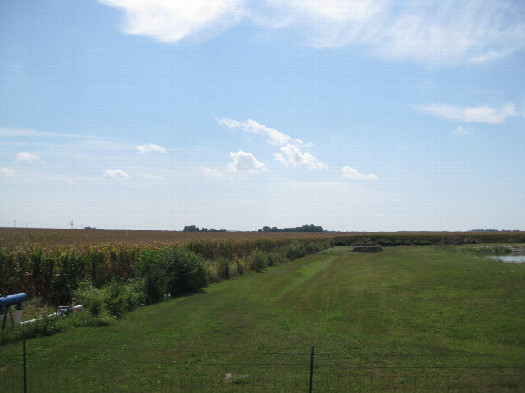 #1: Looking SSE across the water treatment facility to the confluence in the cornfield