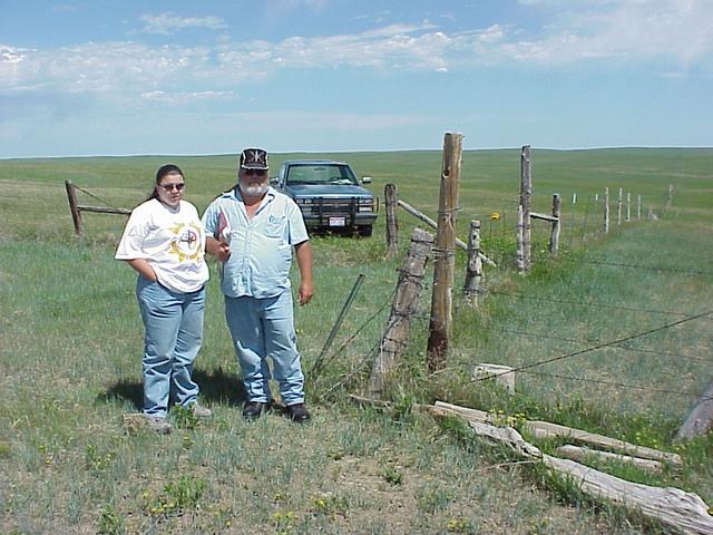 Rae Stone Man and John Whiting stand near the fences that mark the historical surveyed 43 N 103 W point.
