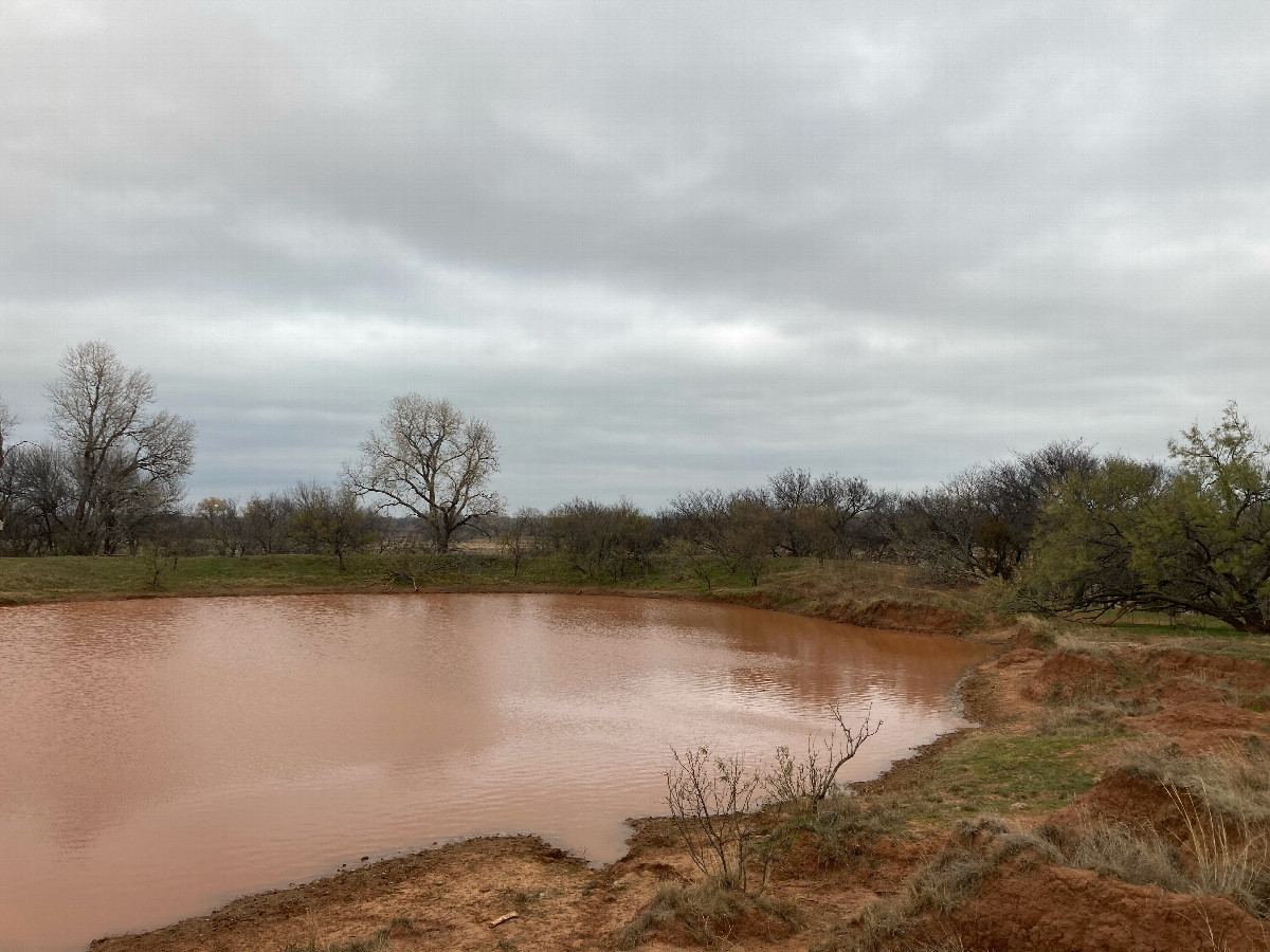 Red pond just before the river valley