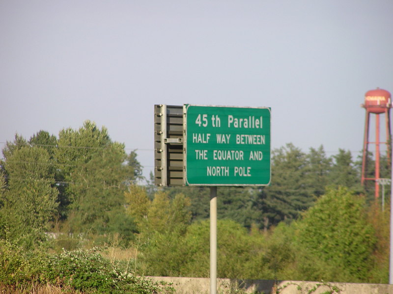 A close-up photo of the sign noting the 45th parallel