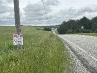 #9: Looking downhill to the east where the confluence is in the middle distance. 