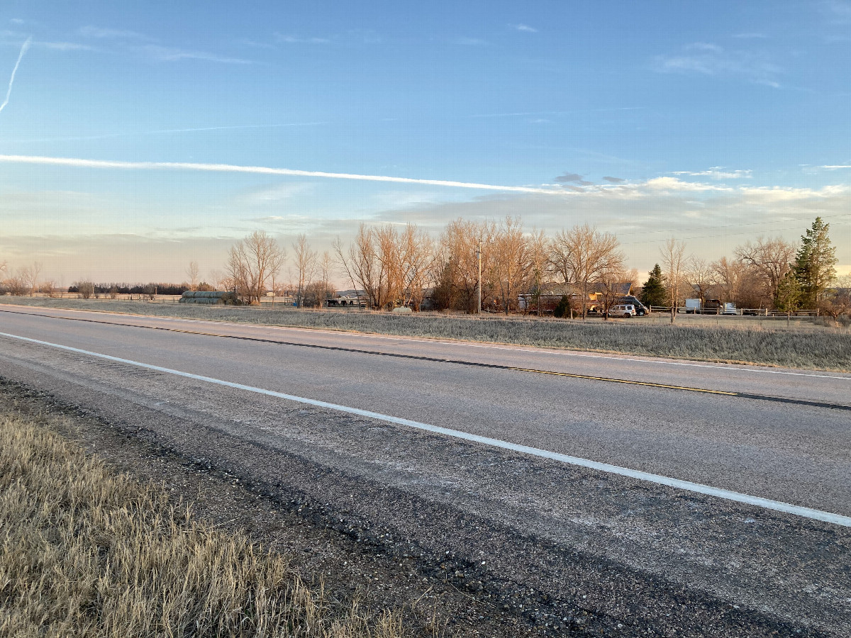Looking southeast at 44N 103W, located in the middle foreground on the westbound lane of SD 44