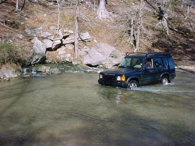 Fording Tom's Spring on the approach. Note the water pouring out of the base of the rock.